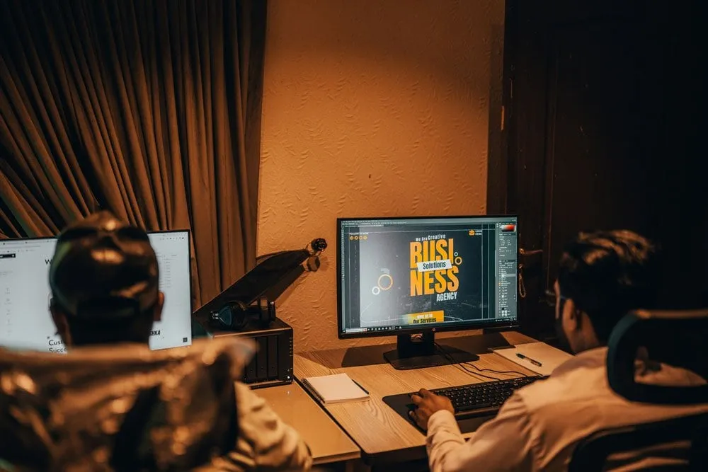 A designer working at dual monitors